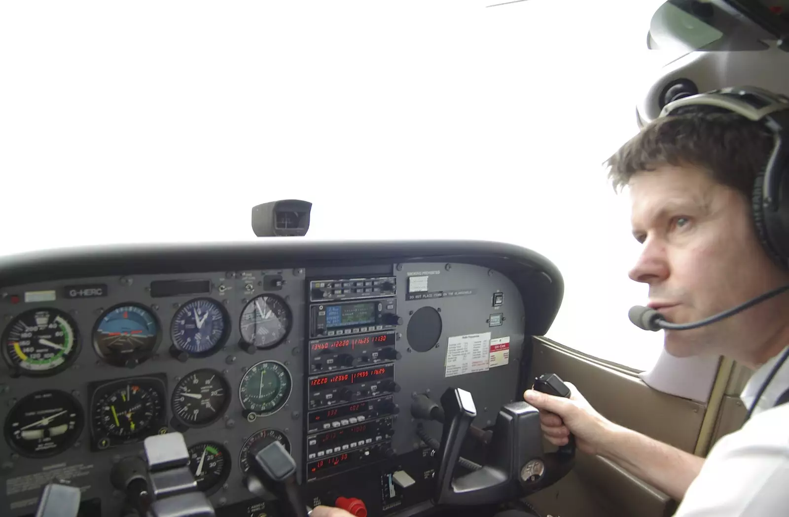 The instructor checks around, from Nosher Flies a Plane, Cambridge Airport, Cambridge - 28th May 2008