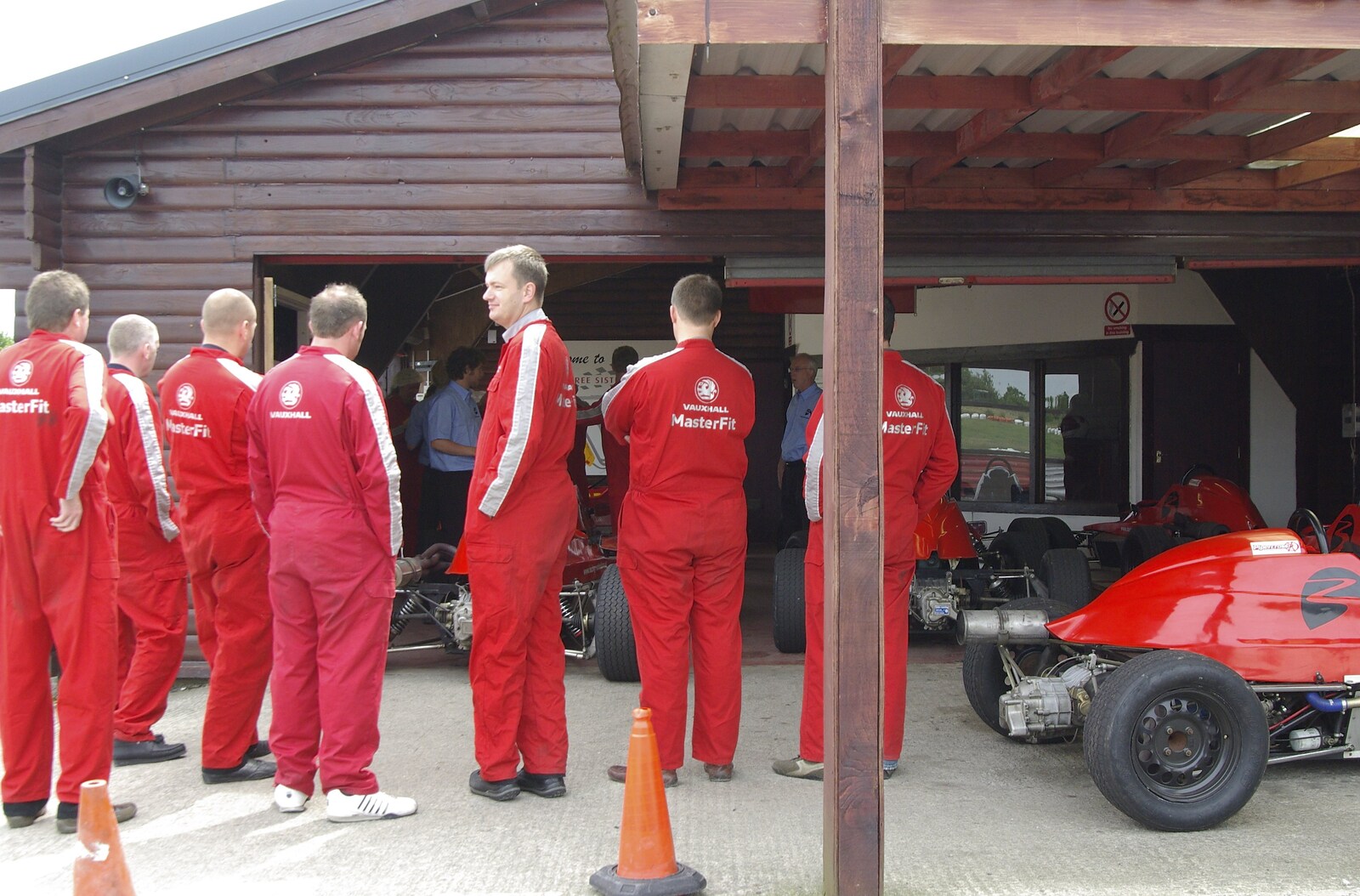 A scrum of drivers by the garage from Driving a Racing Car, Three Sisters Racetrack, Wigan, Lancashire - 24th June 2008