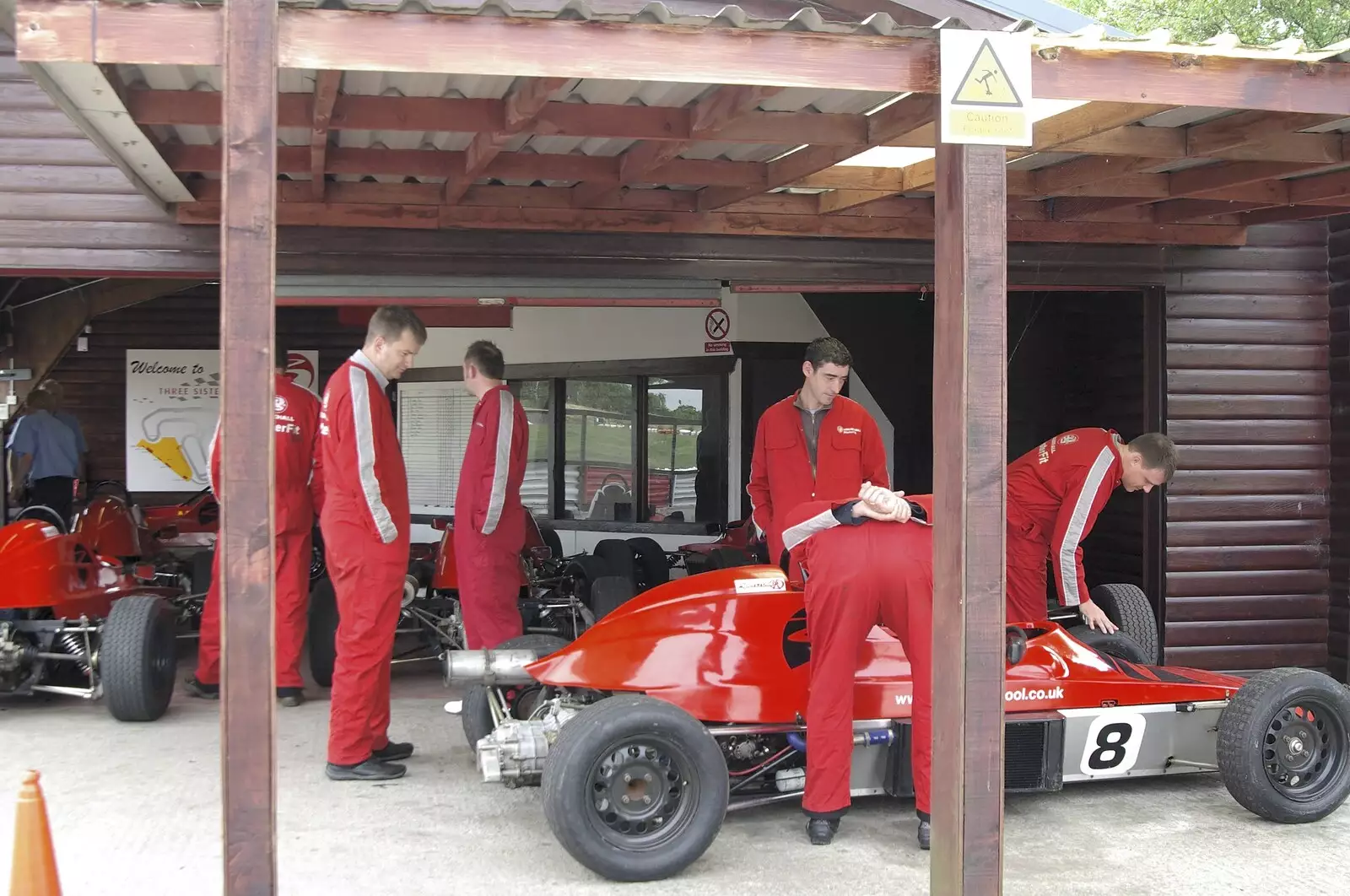 The 'experiencers' mill around the cars, from Driving a Racing Car, Three Sisters Racetrack, Wigan, Lancashire - 24th June 2008