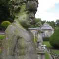 A statue looks sad too, maybe hoping for more visitors to the gardens