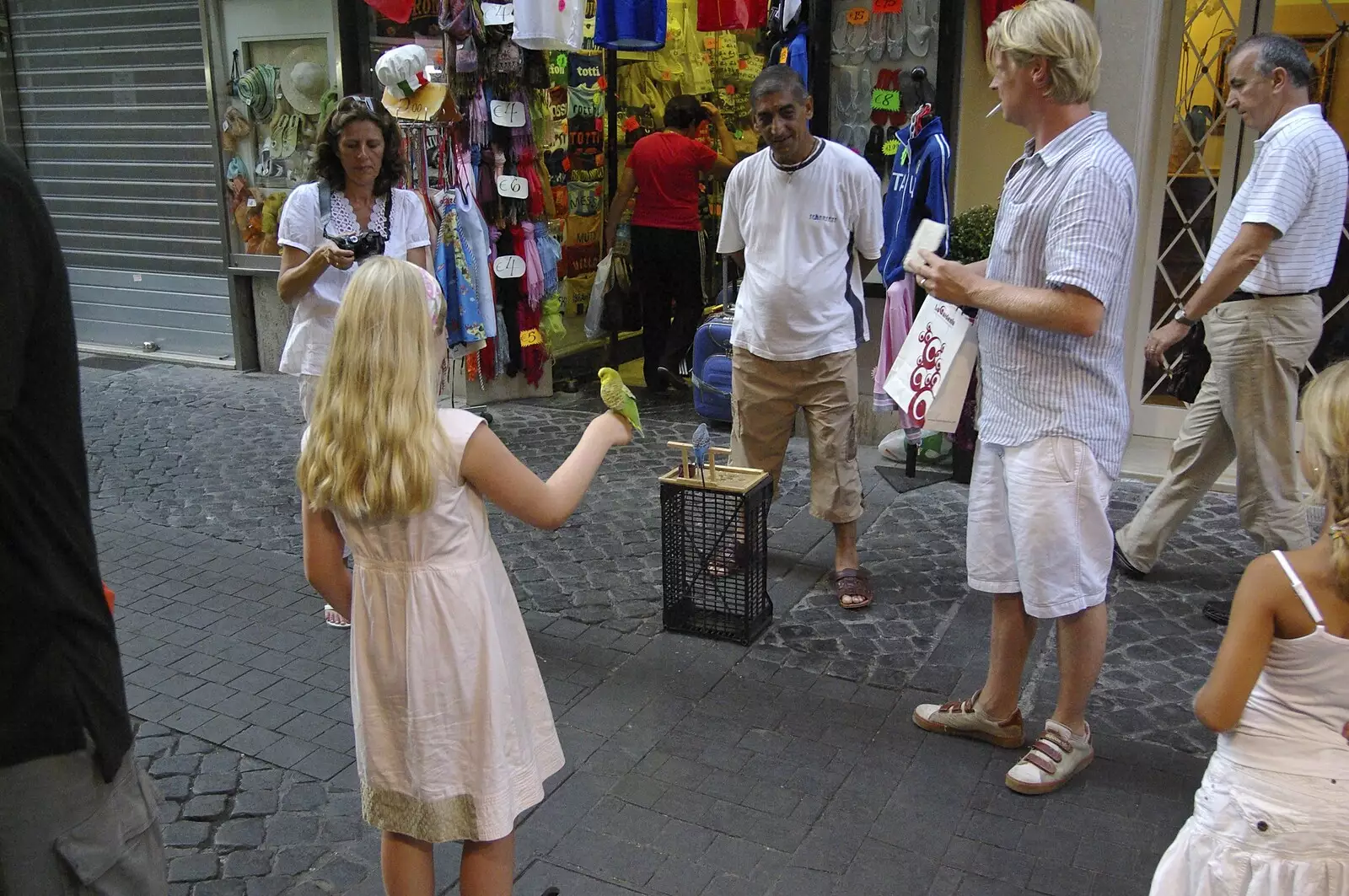 A passing girl is given a budgie for some reason, from A Sojourn in The Eternal City, Rome, Italy - 22nd July 2008