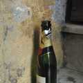 Down-and-out in Rome: a discarded champagne bottle on a step