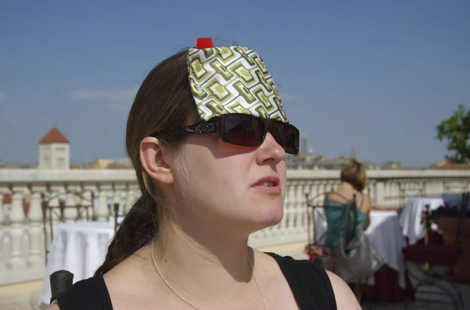 Isobel fashions a shade from her sunglasses case, from A Sojourn in The Eternal City, Rome, Italy - 22nd July 2008