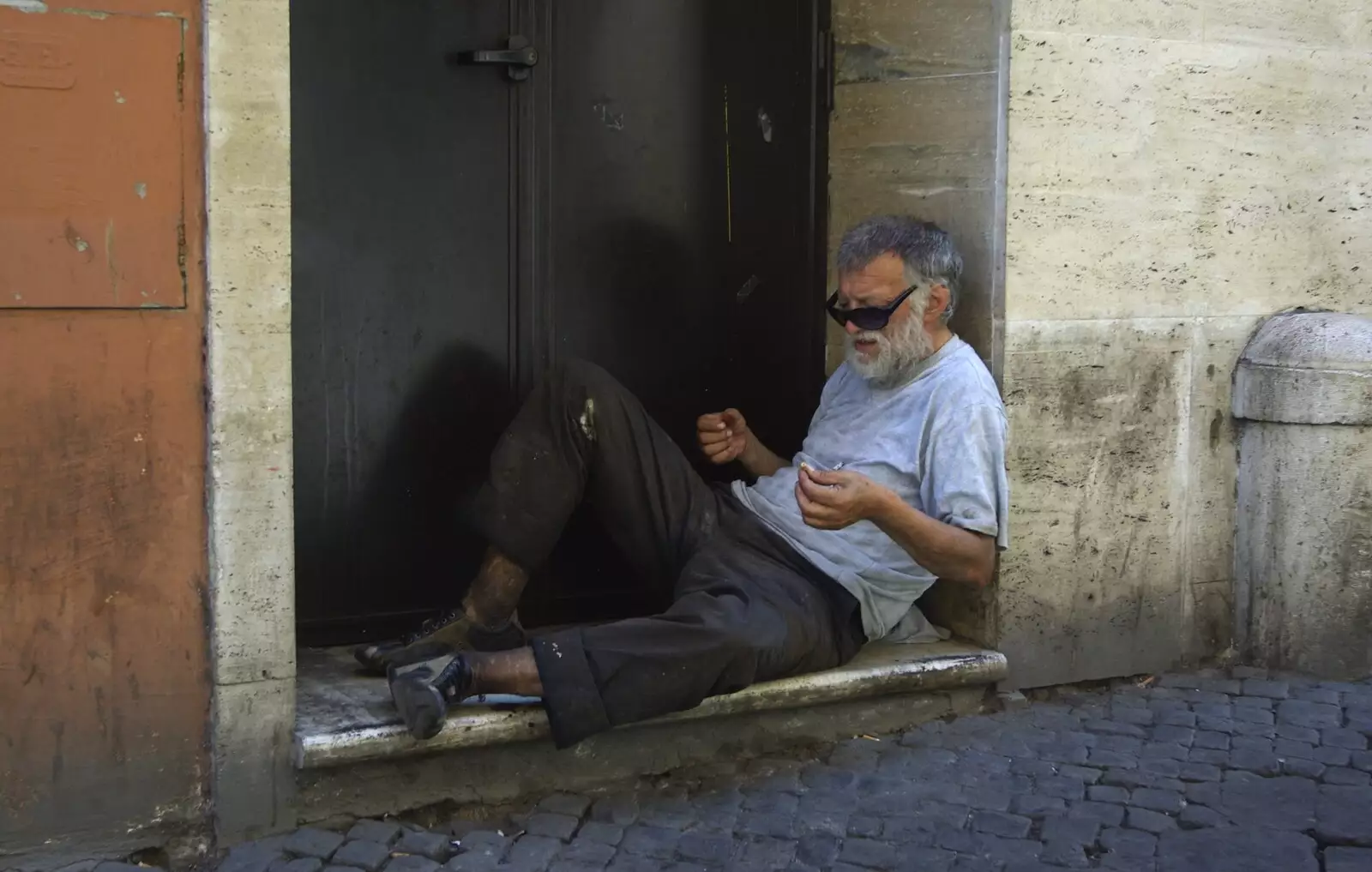 A homeless dude sits in a doorway, from A Sojourn in The Eternal City, Rome, Italy - 22nd July 2008