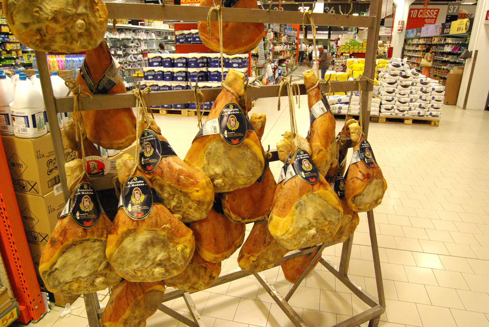 Tenuta Il Palazzo in Arezzo, Tuscany, Italy - 22nd July 2008: A bunch of hanging proscuitto hams in the Ipercoop
