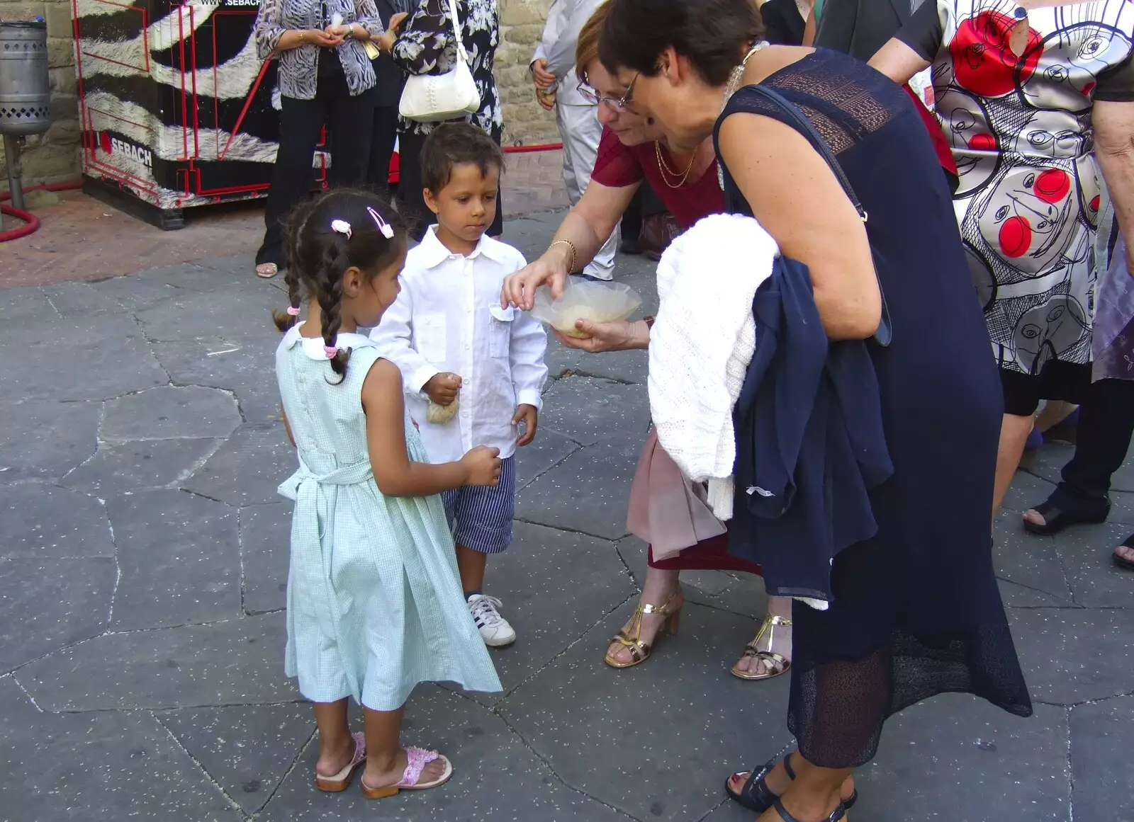 Small children get offered something, from A Day Trip to Firenze, Tuscany, Italy - 24th July 2008