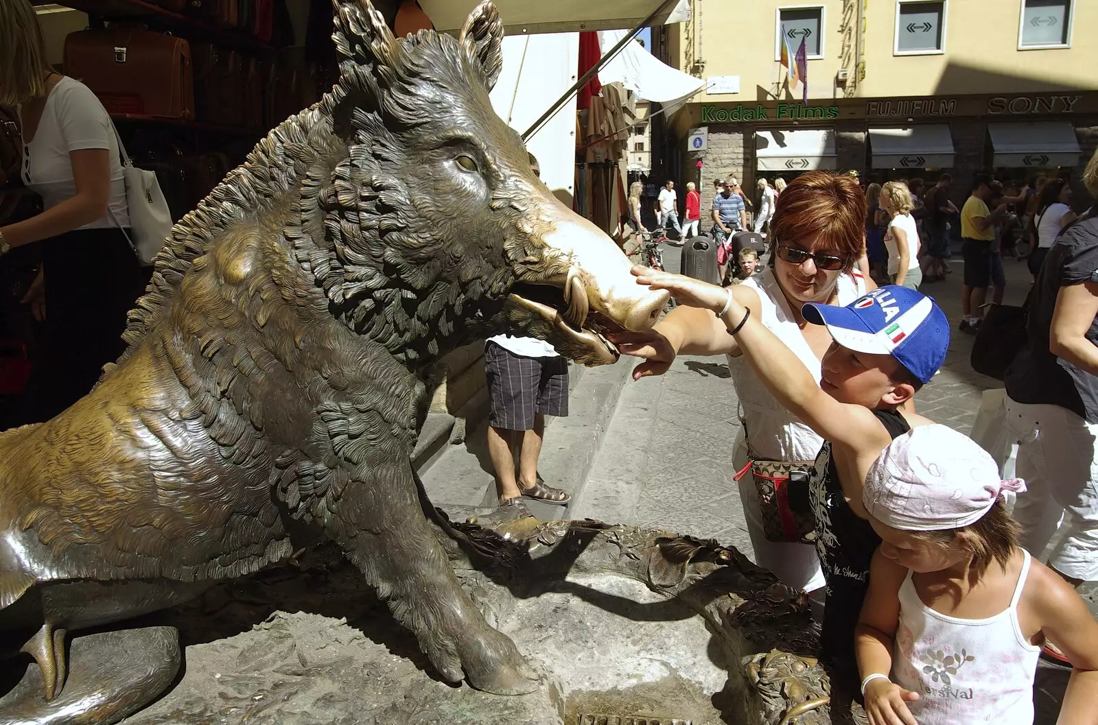 Kids stroke the nose of a drooling bronze boar, from A Day Trip to Firenze, Tuscany, Italy - 24th July 2008