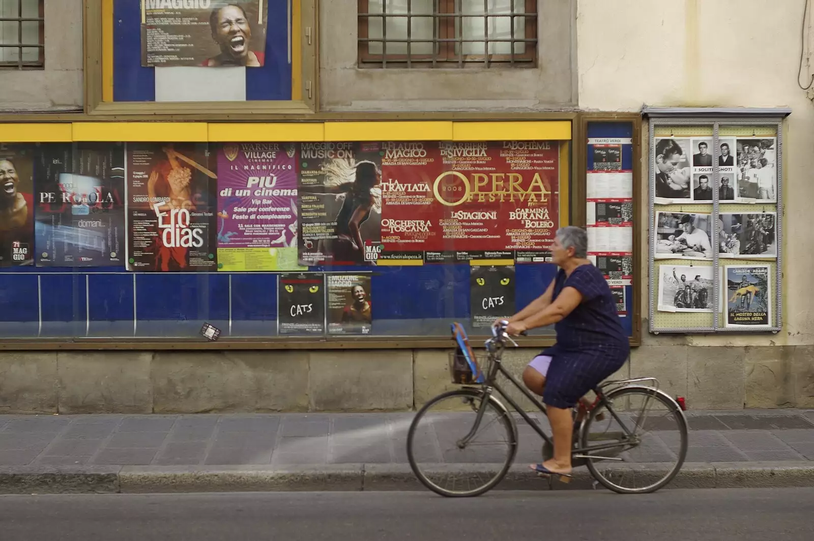 A woman cycles past, from A Day Trip to Firenze, Tuscany, Italy - 24th July 2008