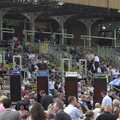 Assembled crowds and bet boards at the July Course, Newmarket