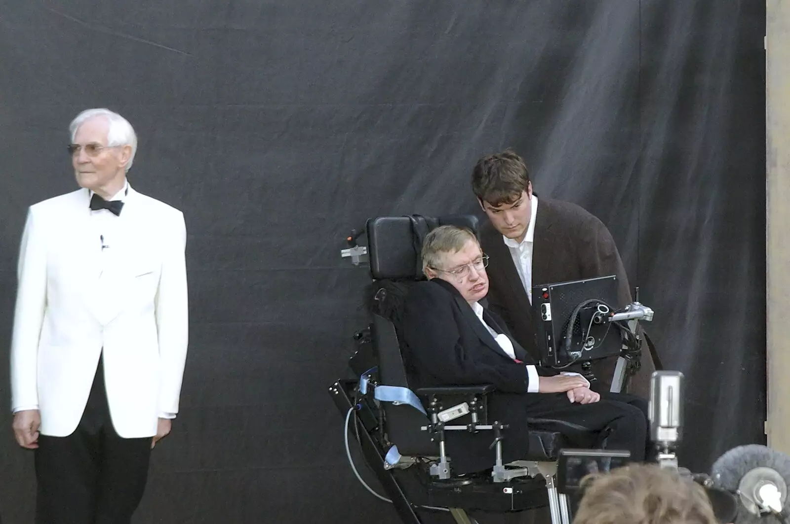 John Taylor (in the white tux) and Stephen Hawking, from A Brief Time in History: Stephen Hawking and the Corpus Christi Clock, Benet Street, Cambridge - 19th September 2008