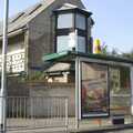 The next day, on Mill Road, someone has perched a cone on the roof of a bus shelter