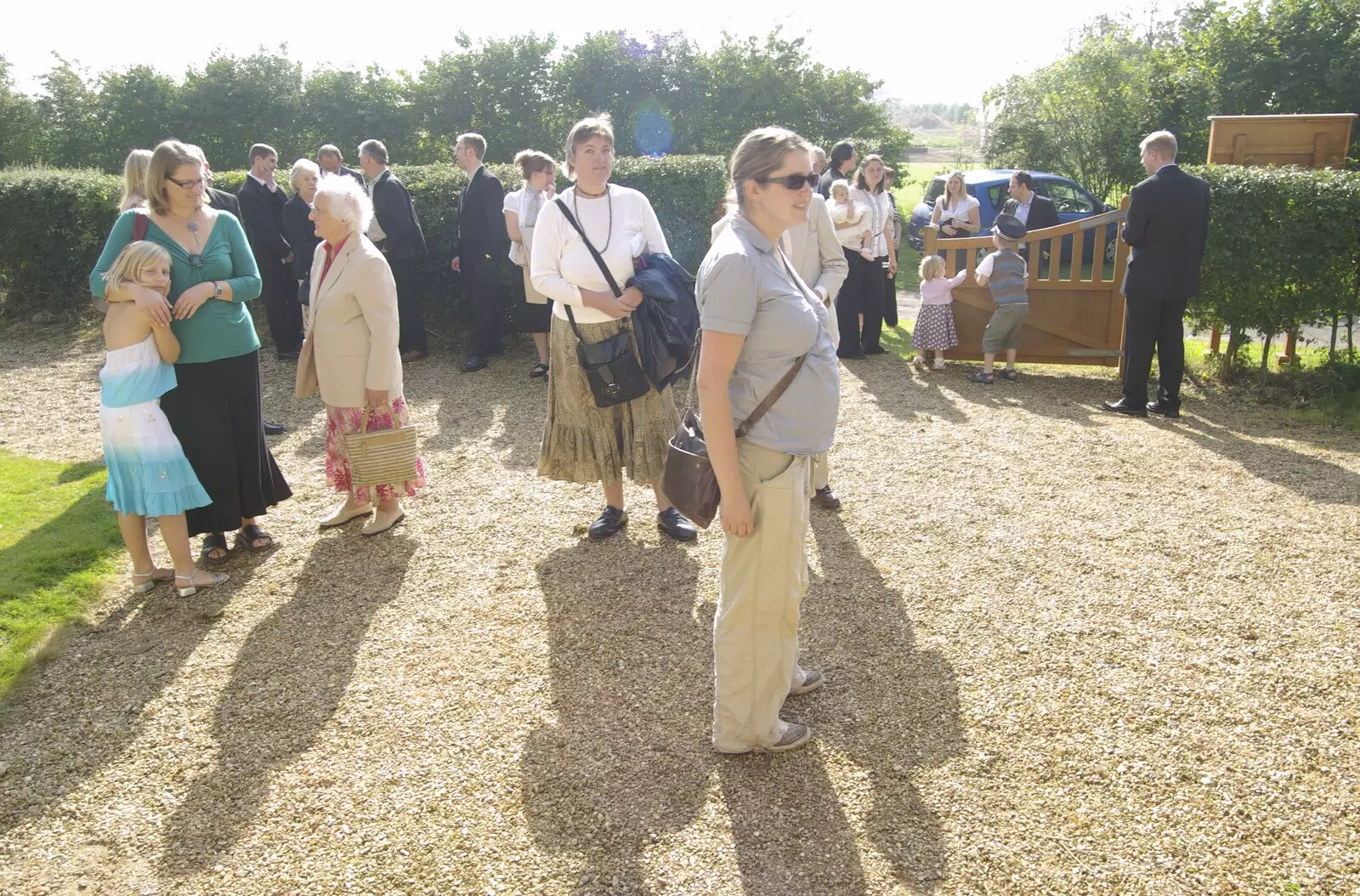 Contra jour: people mill around outside the church, from Jessica's Christening and Fred's First Outing, Thrandeston and Brome, Suffolk - 28th September 2008