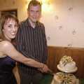 Carmen and Bill cut the cake
