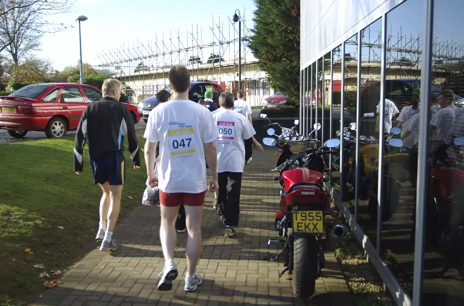 The runners walk round the building, from The Cambridge Fun Run, Milton Road, Cambridge - 14th November 2008