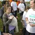 Isobel eats some muffin, The Cambridge Fun Run, Milton Road, Cambridge - 14th November 2008