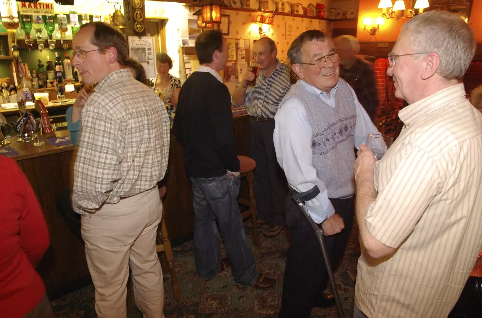 John Willy chats to someone by the fruit machine, from The Swan Inn's 25th Anniversary, Brome, Suffolk - 14th November 2008