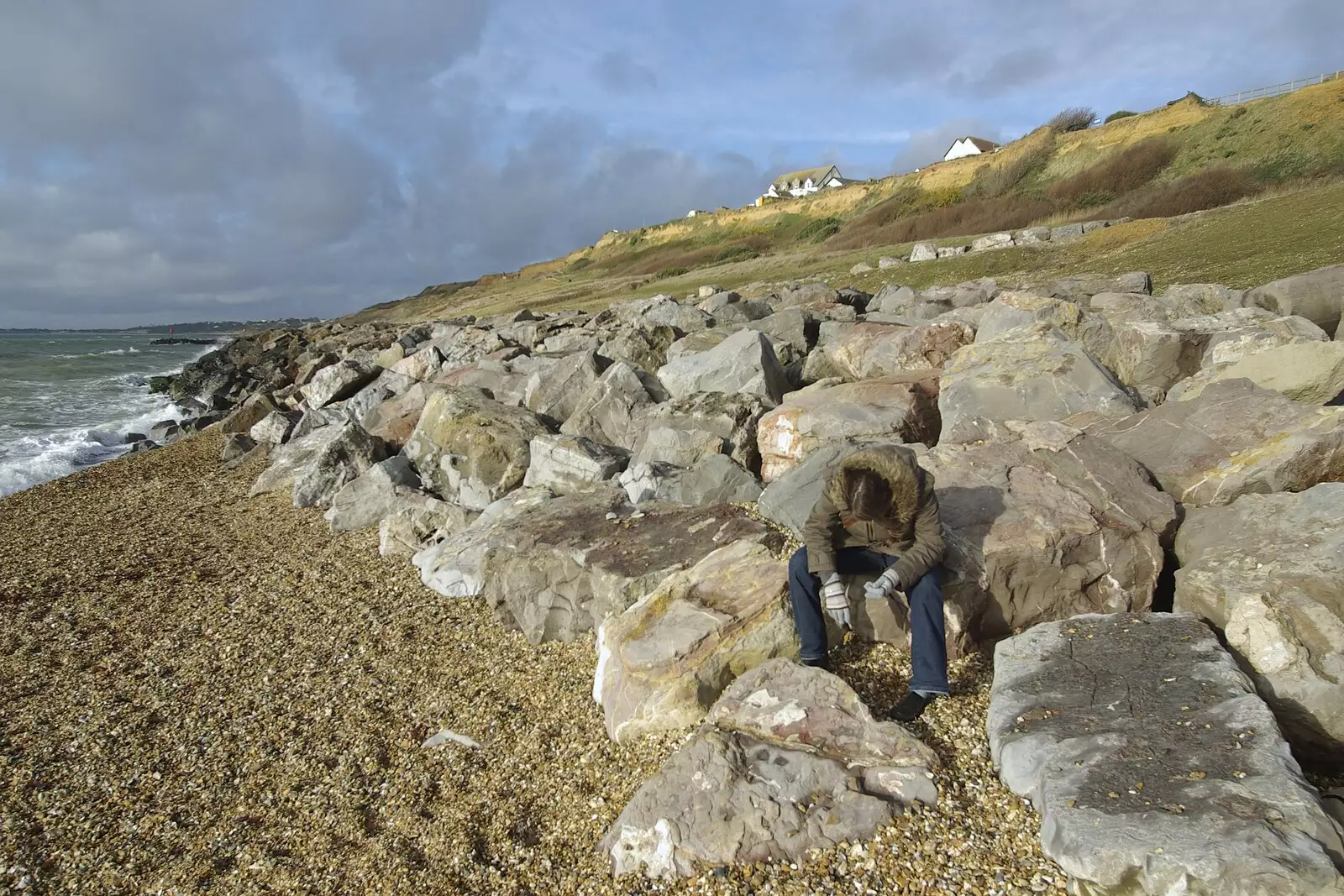 Isobel makes like a rock on the sea front, from A Trip to New Milton and Barton-on-Sea, Hampshire - 27th November 2008