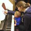 Isobel teaches a bit of piano to Fred