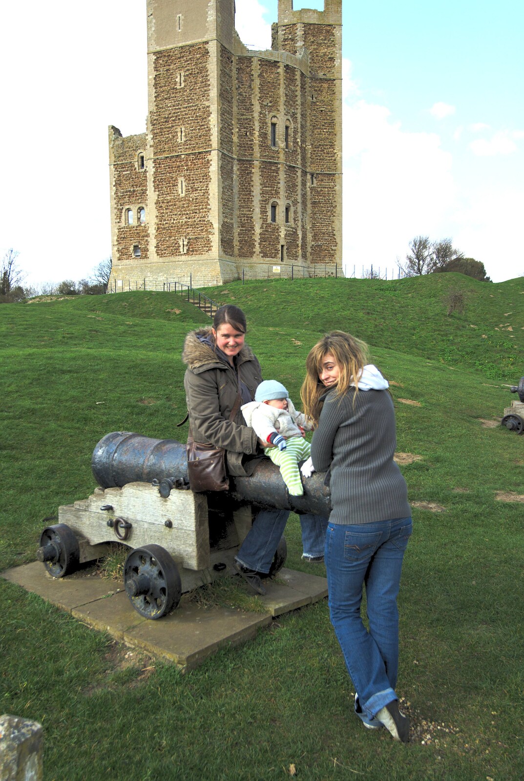 The gang mess about on an old cannon from A Trip to Orford Castle, Suffolk - 14th March 2009