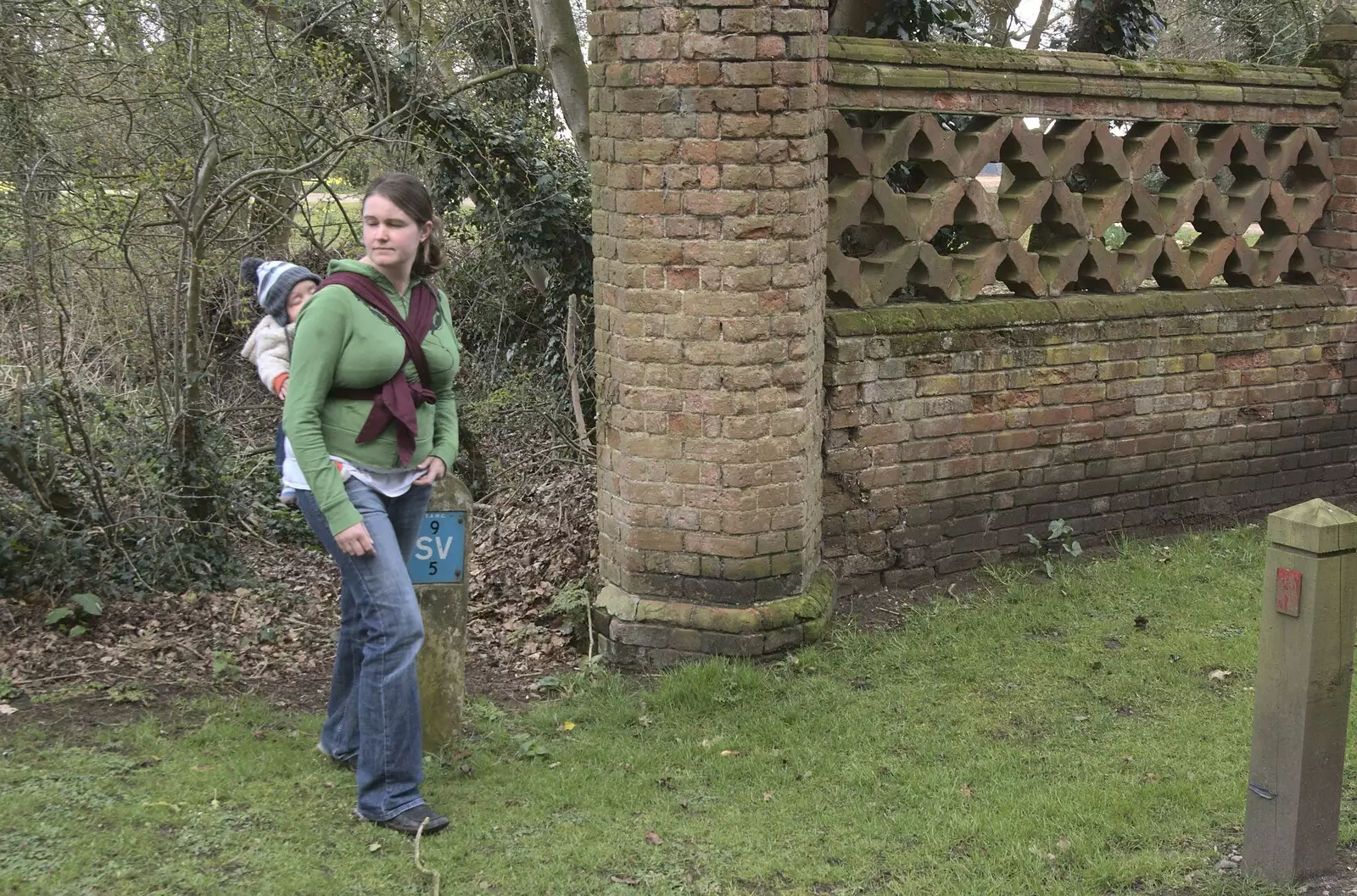 Isobel by Brome Hall's wall, from Quiz Night, the Flat, and a Walk Around the Fields, North Lopham, Cambridge and Brome, Suffolk - 29th March 2009