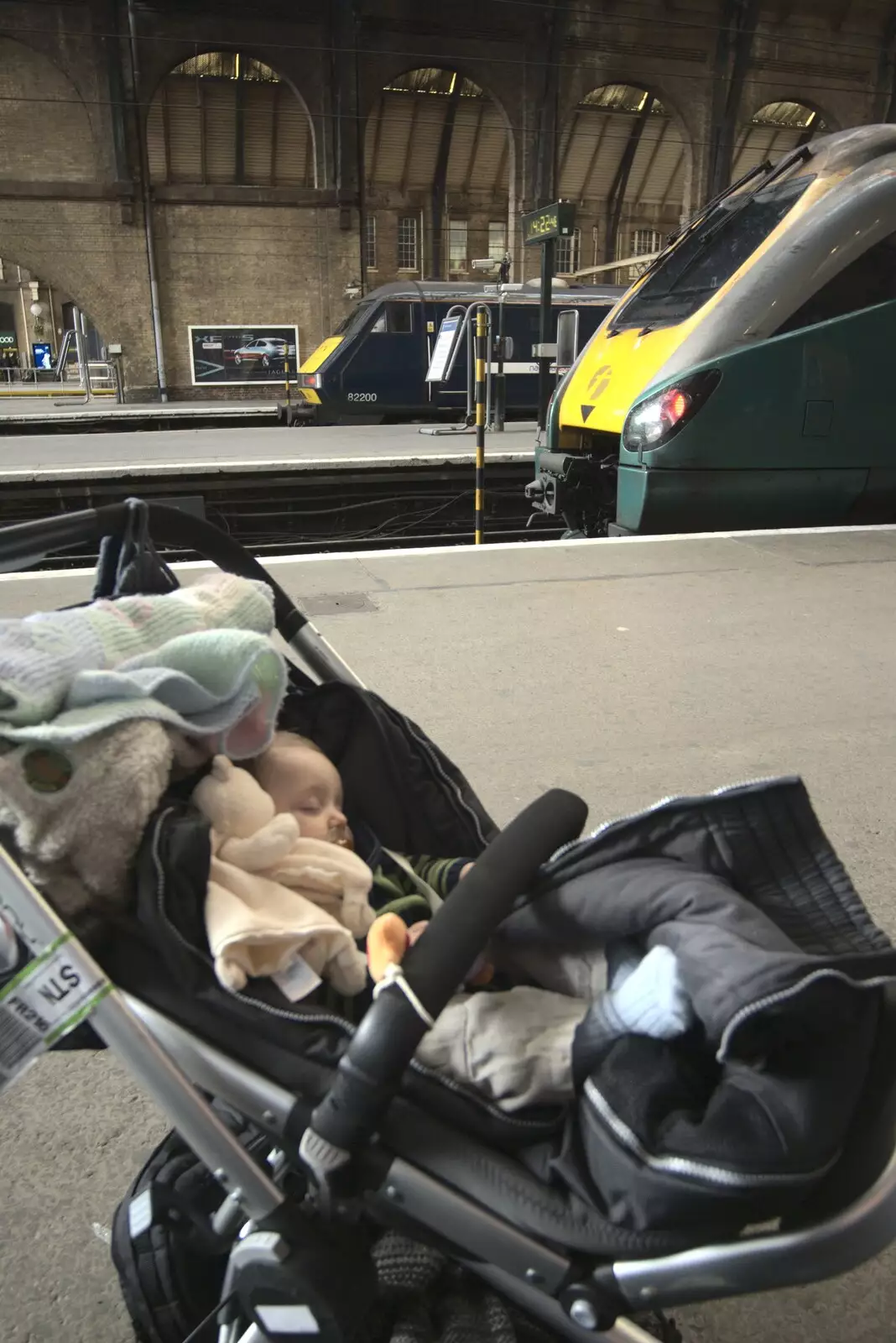 Fred has a doze on a platform at Kings Cross, from A Day Trip to Brussels, Belgium - 5th April 2009