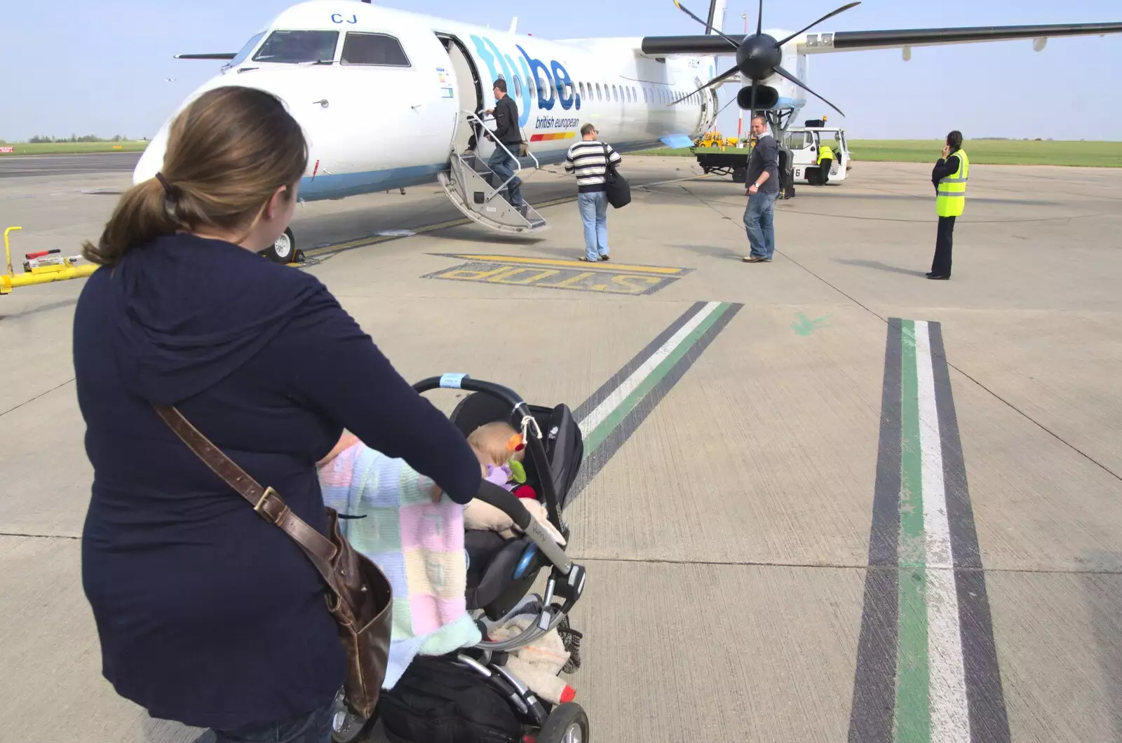 Isobel and Fred head on to the Flybe Dash-8, from An Easter Weekend in Chagford, Devon - 12th April 2009