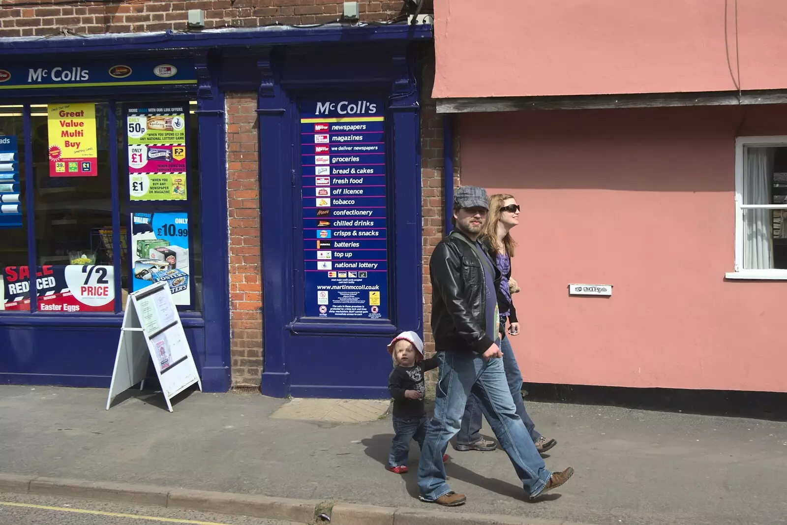 Lucy, Sam and Rachel walk past McColl's, from A Visit from Rachel and Sam, Brome, Suffolk - 26th April 2009