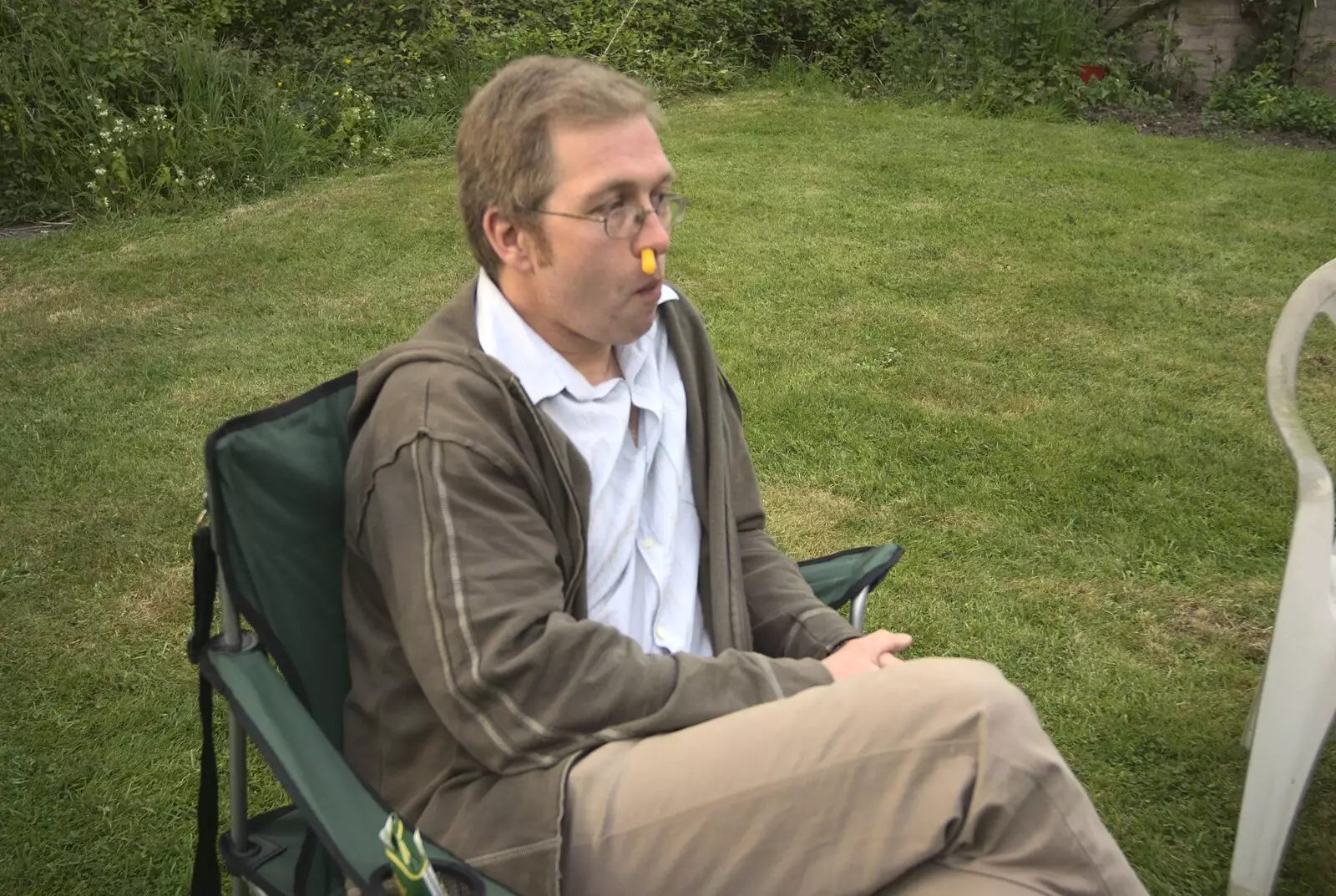 Marc sticks a Whatsit up his nose, from The BSCC at Bressingham Chequers, and a Garden Barbeque, Brome, Suffolk - 2nd May 2009