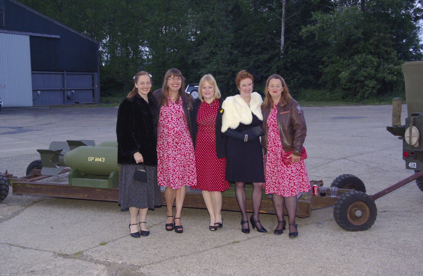 A gang of women by a bomb trailer from The Debach Airfield 1940s Dance, Debach, Suffolk - 6th June 2009