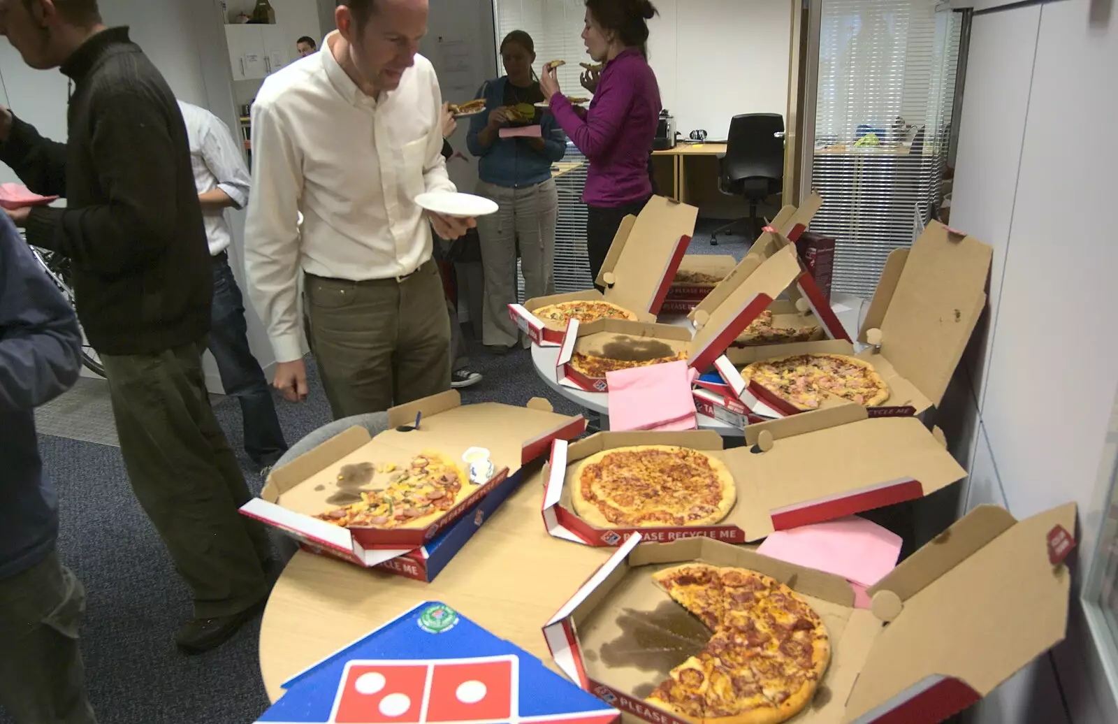 In the Taptu office, Jake inspects a pile of pizza, from A June Miscellany: The End of Days, and Al Leaves Taptu, Diss and Cambridge - 13th June 2009