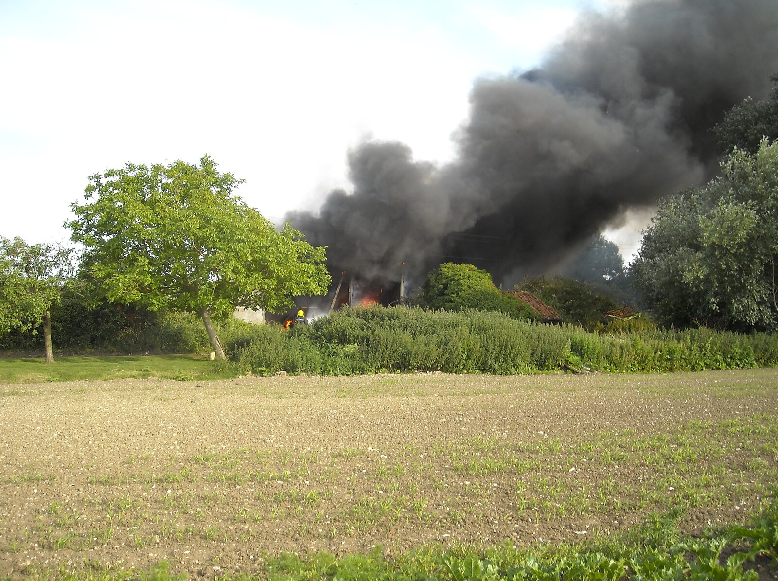 Smoke billows over the fields from A Fire at Valley Farm, Thrandeston, Suffolk - 24th June 2009