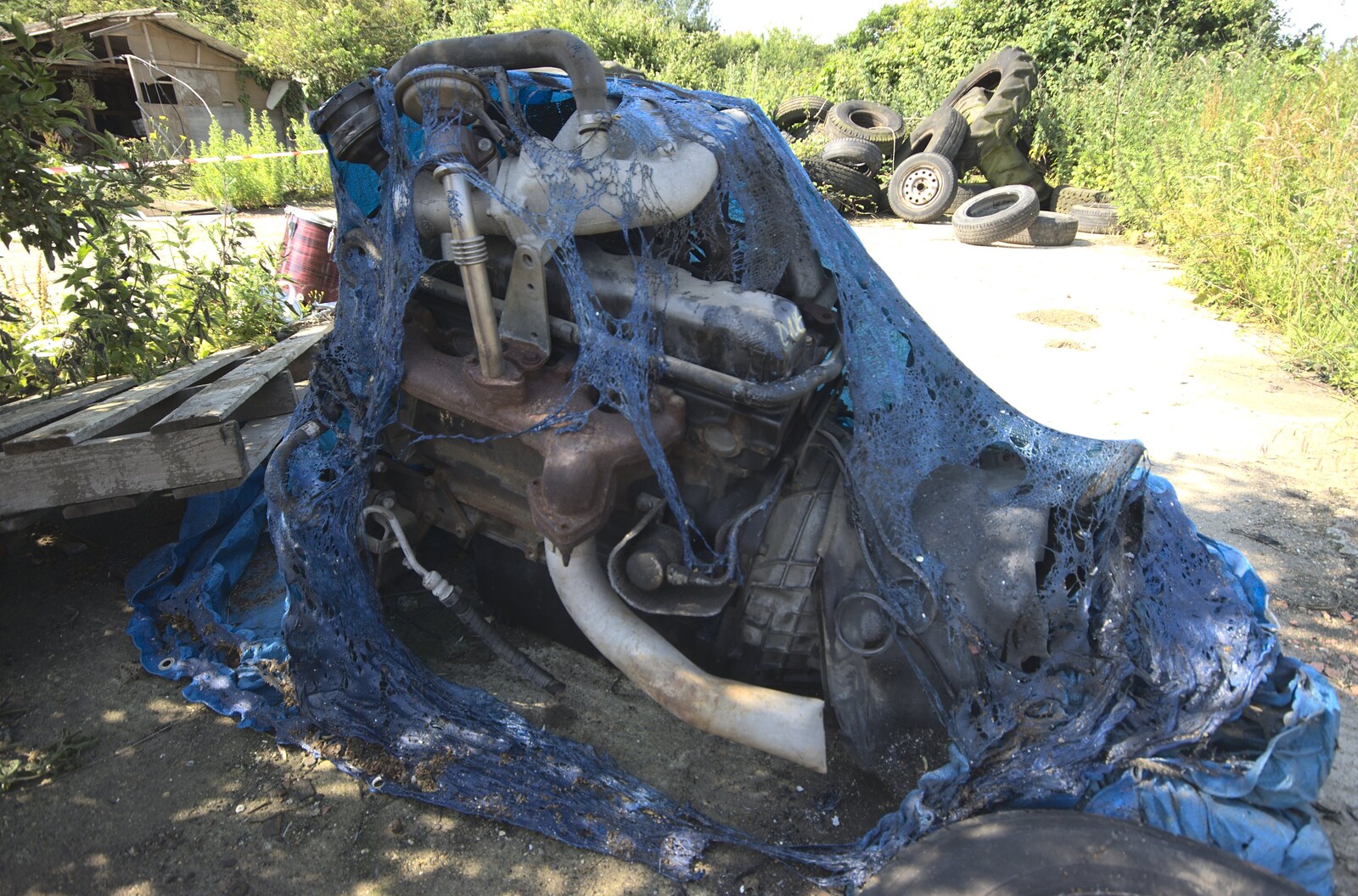 A nearby engine is covered in melted plastic from A Fire at Valley Farm, Thrandeston, Suffolk - 24th June 2009
