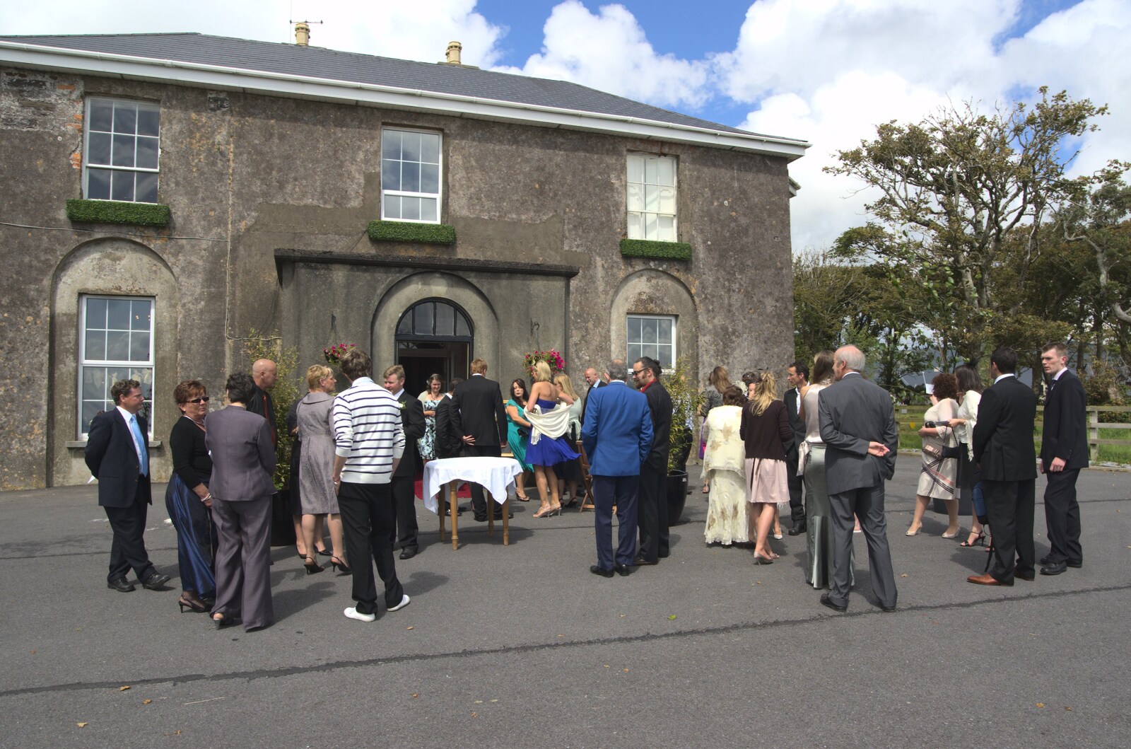 Guests hang around outside Ballintaggart from Julie and Cameron's Wedding, Ballintaggart House, Dingle - 24th July 2009