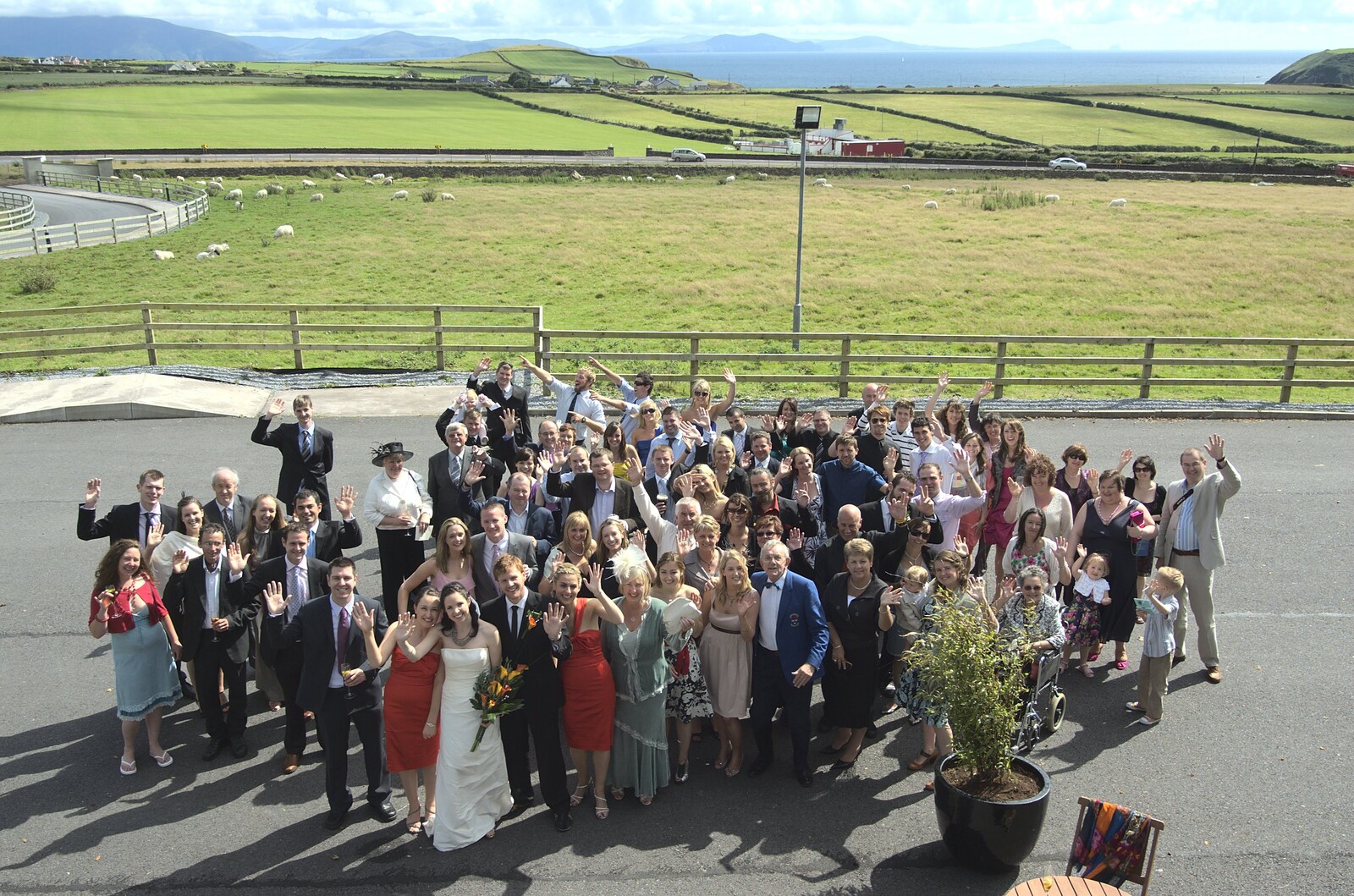 The entire wedding party waves up to the window from Julie and Cameron's Wedding, Ballintaggart House, Dingle - 24th July 2009