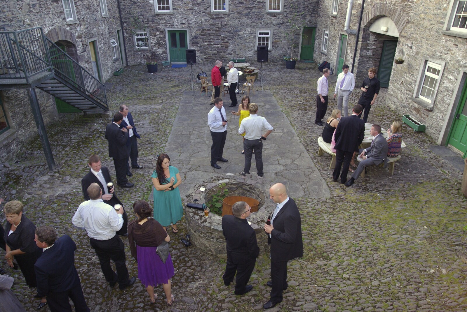 The wedding moves out to the courtyard from Julie and Cameron's Wedding, Ballintaggart House, Dingle - 24th July 2009