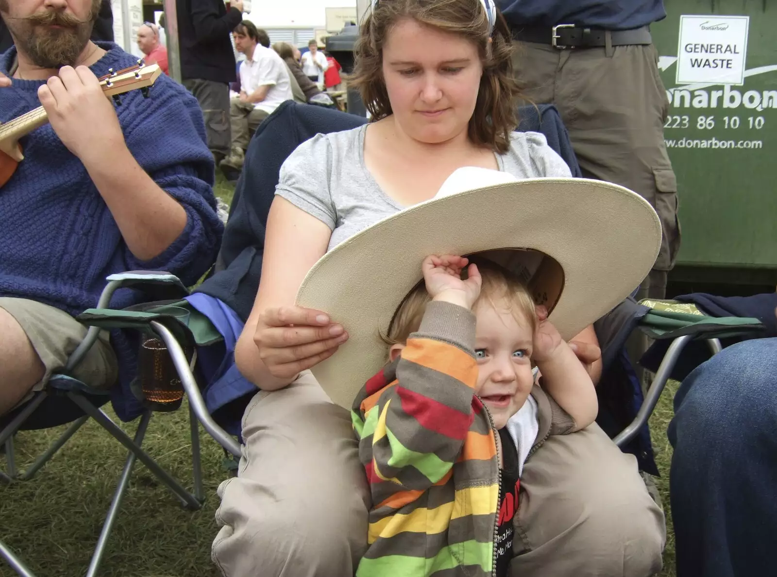 Fred tries on Adrian's hat. It's a little on the large side, from The Cambridge Folk Festival, Cherry Hinton Hall, Cambridge - 1st August 2009