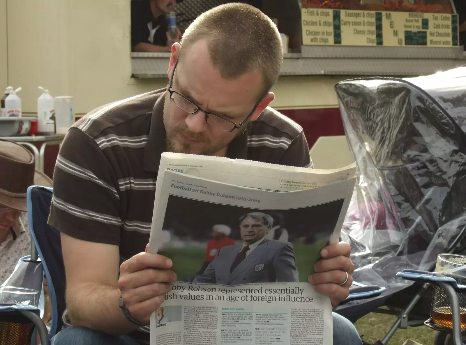 Matt reads a spot of newspaper, from The Cambridge Folk Festival, Cherry Hinton Hall, Cambridge - 1st August 2009