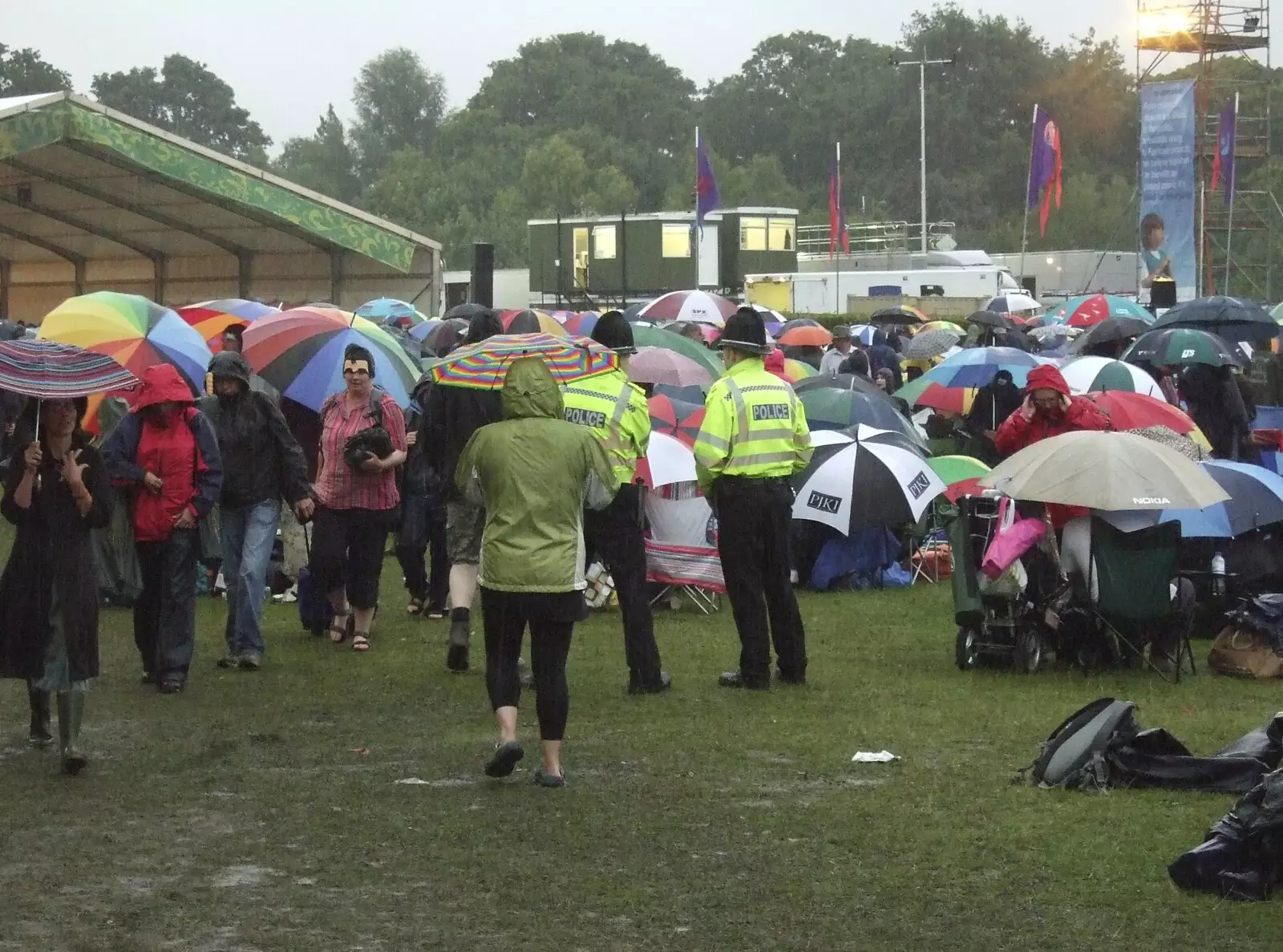 Even the rozzers have to stick out the rain, from The Cambridge Folk Festival, Cherry Hinton Hall, Cambridge - 1st August 2009