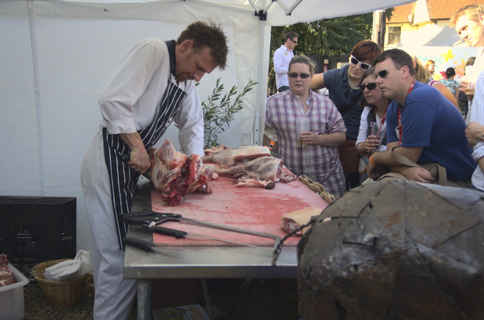 A butchery demonstration is occuring from Harvest Festival at Jimmy's Farm, Wherstead, Suffolk - 12th September 2009