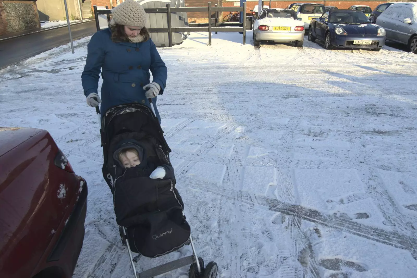 Isobel negotiates the ice the Chapel Street car park, from Snow in Diss, Fred Walks, and The BBs Play a Wedding, Diss and Mendlesham - 18th December 2009