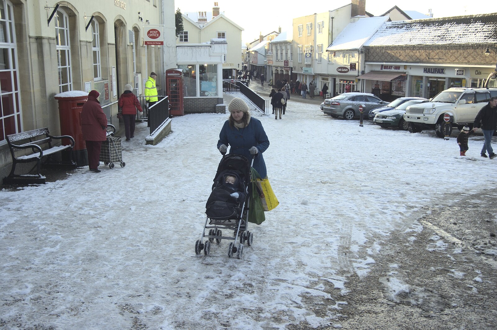 Isobel struggles up the market place in Diss from Snow in Diss, Fred Walks, and The BBs Play a Wedding, Diss and Mendlesham - 18th December 2009