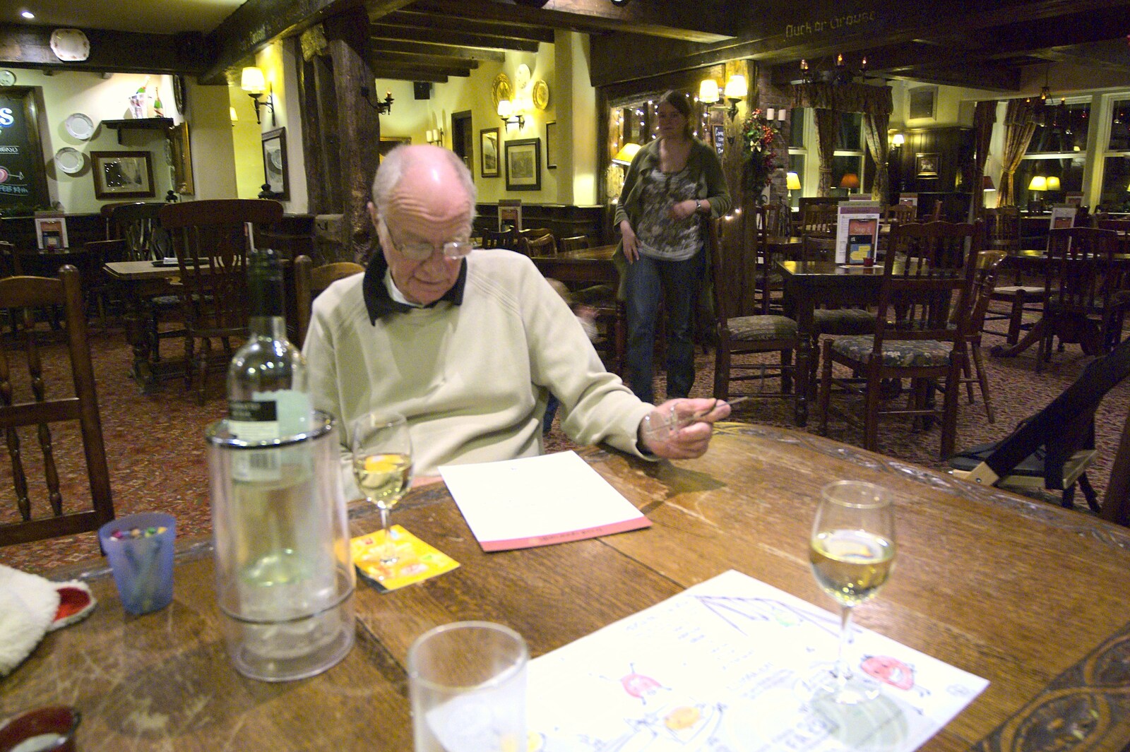 Grandad scopes the menu out from Christmas at Number 19, Blackrock, County Dublin, Ireland - 25th December 2009