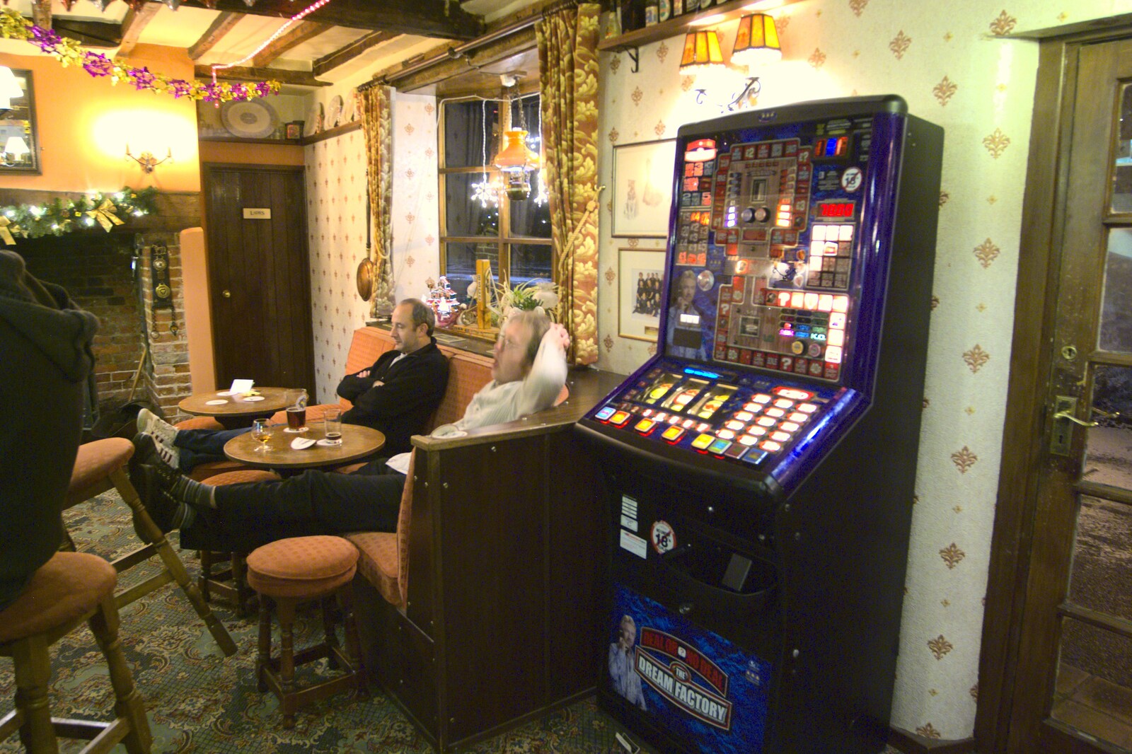 DH and Marc near the fruit machine from New Year's Eve at the Swan Inn, and Moonlight Photos, Brome, Suffolk - 31st December 2009