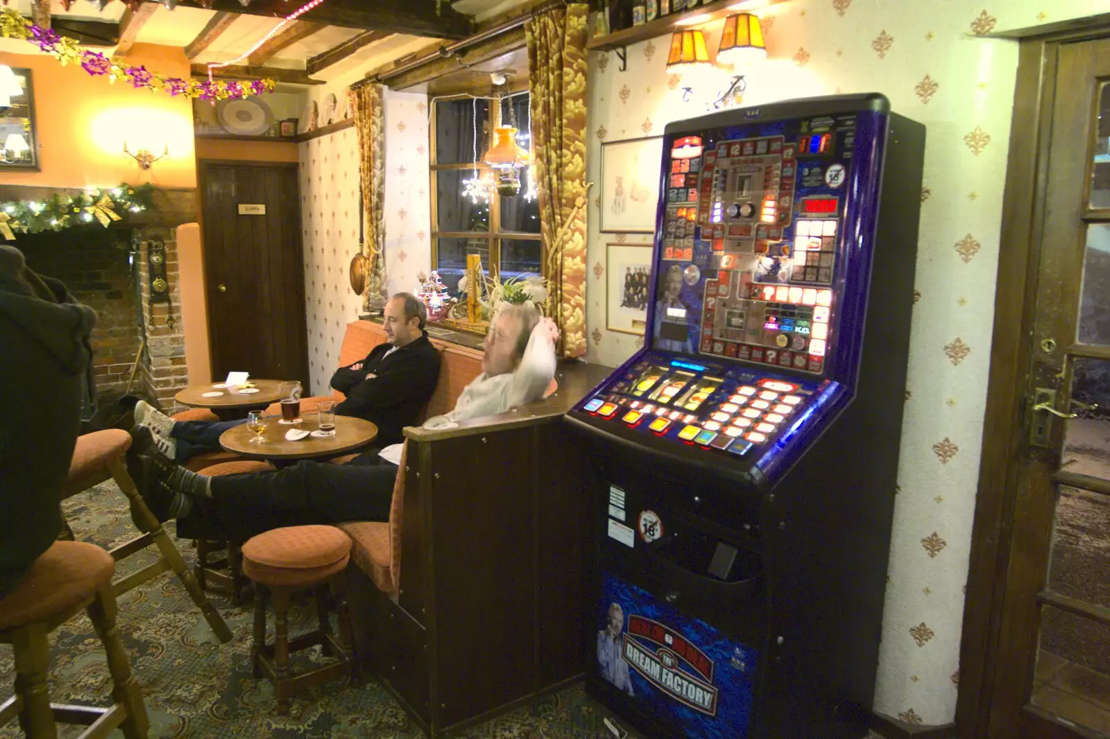 DH and Marc near the fruit machine, from New Year's Eve at the Swan Inn, and Moonlight Photos, Brome, Suffolk - 31st December 2009