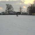 A paperboy cycles over the park in Diss, A Snowy Miscellany, Diss, Norfolk - 9th January 2010