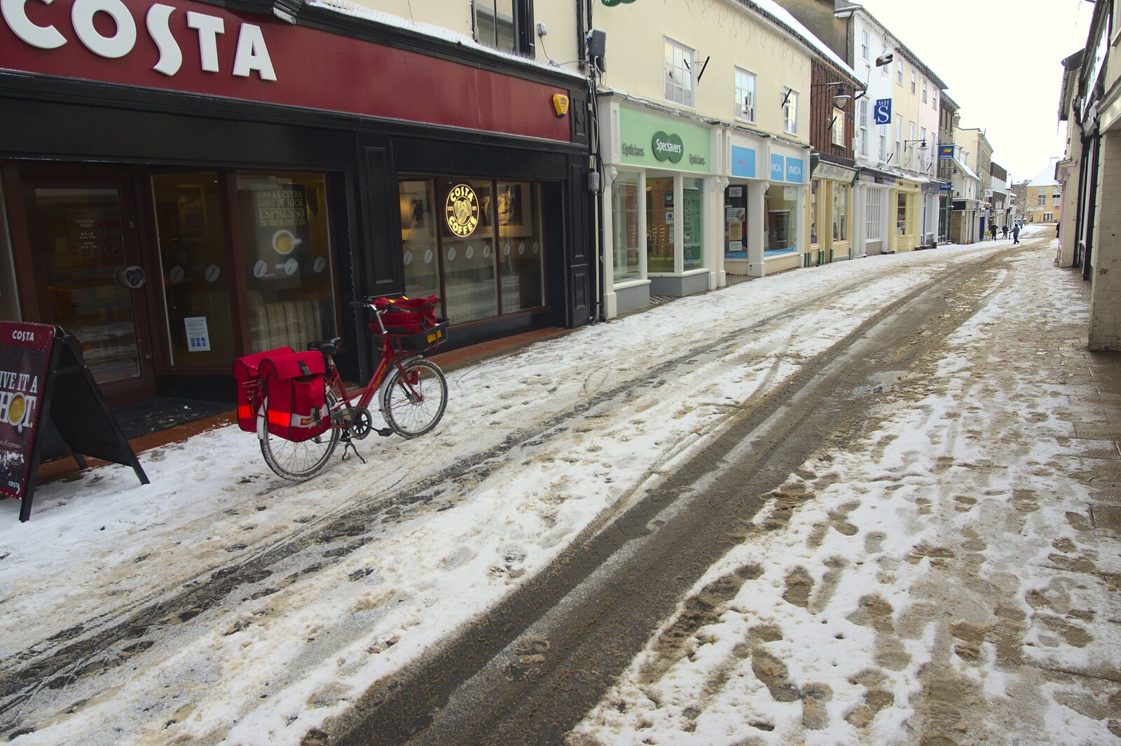A Snowy Miscellany, Diss, Norfolk - 9th January 2010: The Postie's bike outside Costa