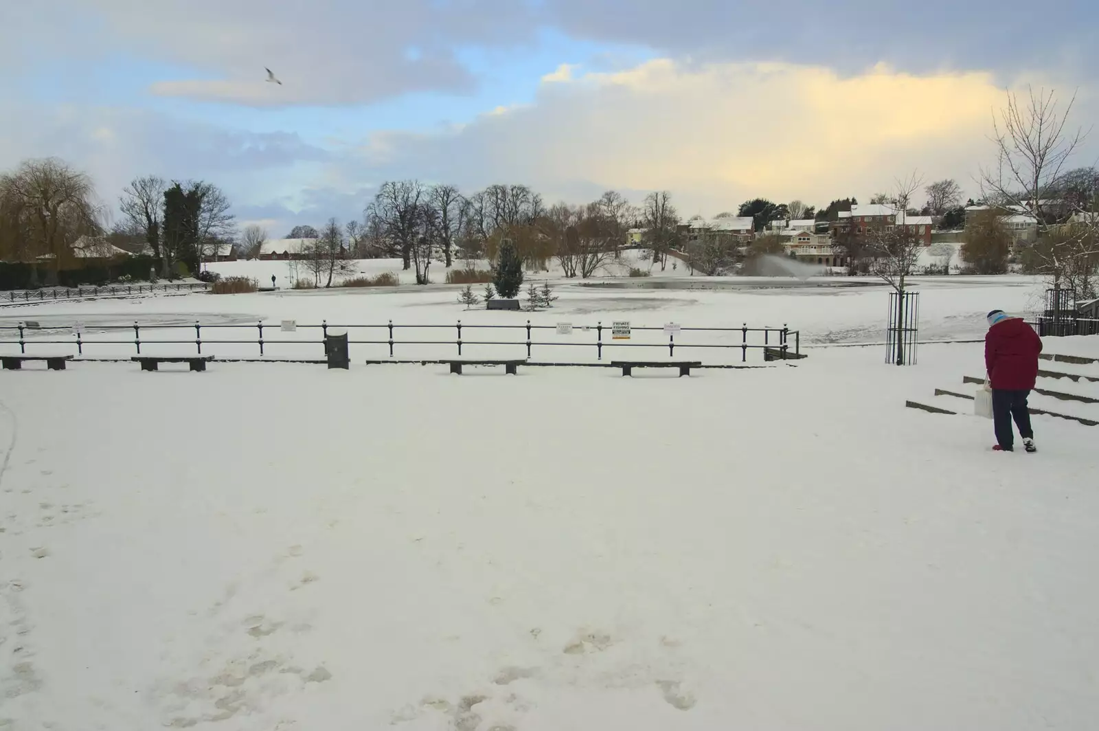 Somebody stumps around the snowy Mere's Mouth, from A Snowy Miscellany, Diss, Norfolk - 9th January 2010