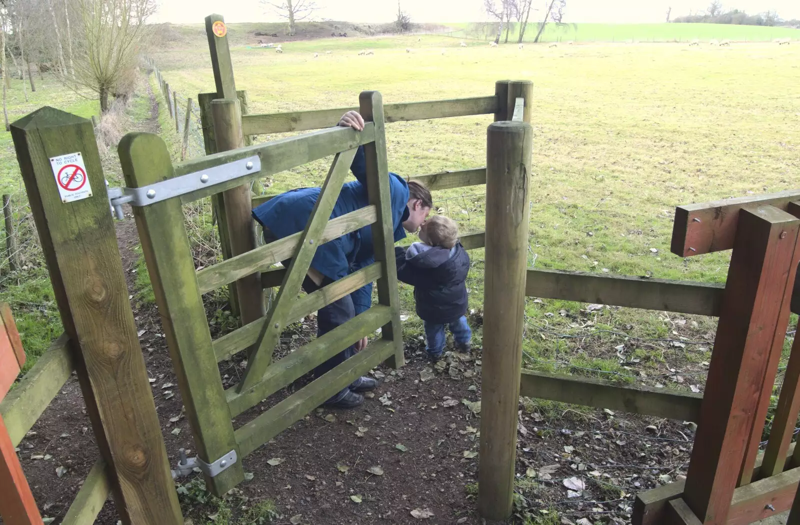 Isobel kisses Fred at the kissing gate, from A Cycle to The Laundries, and a Trip to Framlingham, Suffolk - 24th March 2010