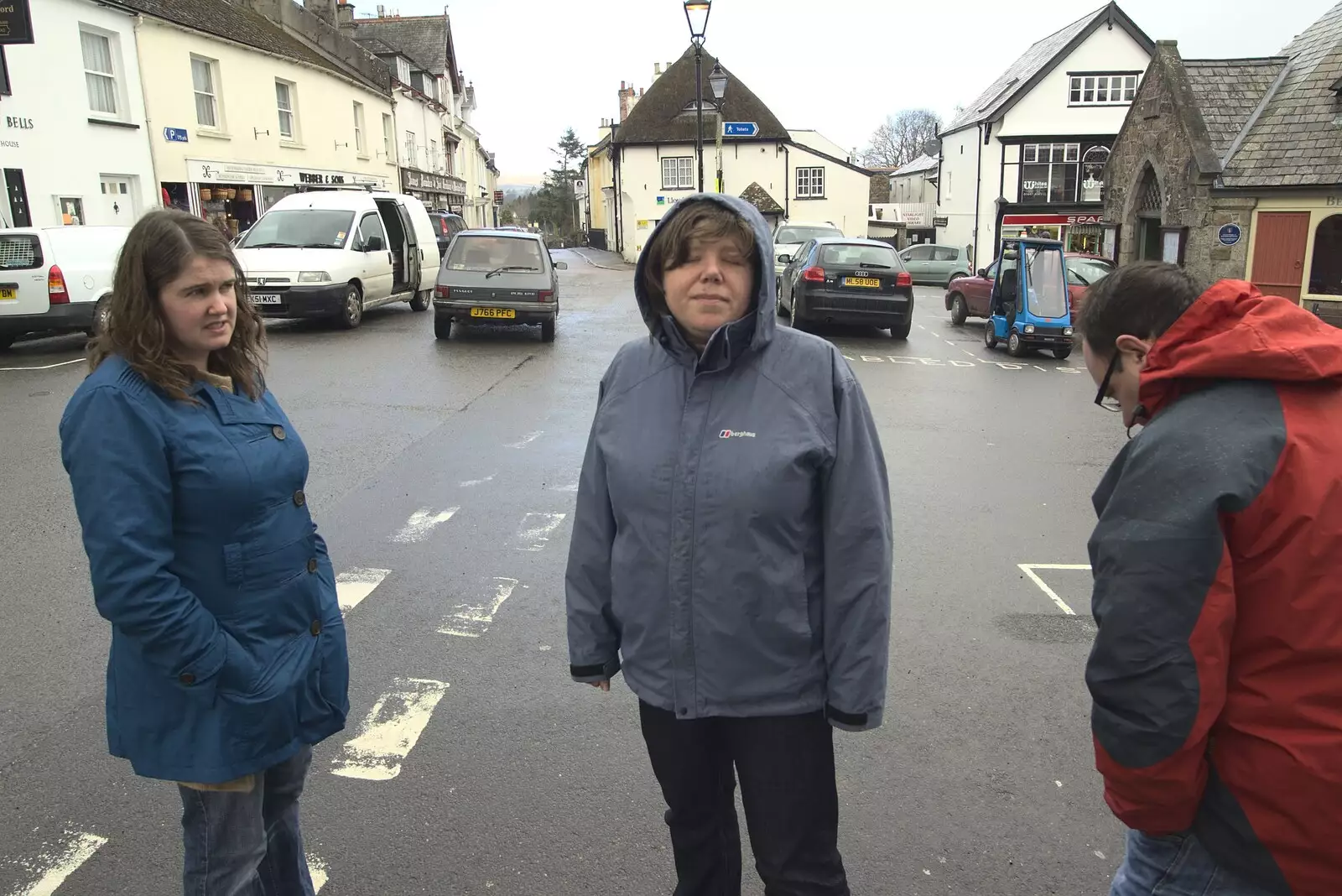 Isobel, Matt and Sis in a rainy Chagford square, from Easter in Chagford and Hoo Meavy, Devon - 3rd April 2010