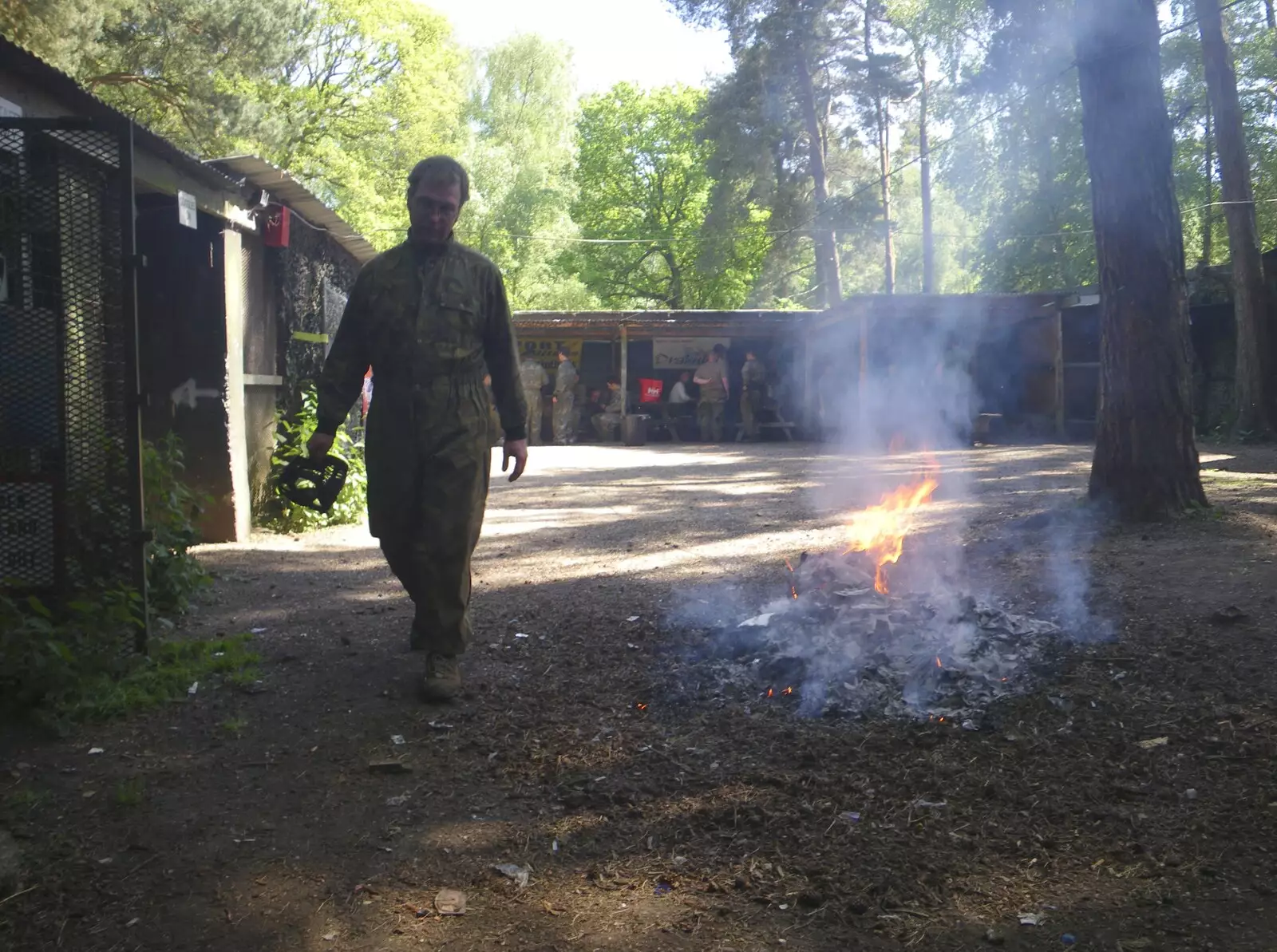 Marc wanders over in a kind of 'war is hell' style, from Nosher's Stag Weekend: Paintball at Emery Down, and Lymington, Hampshire - 22nd May 2010